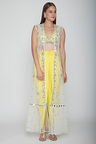 yellow embroidered blouse with dhoti skirt & white cape