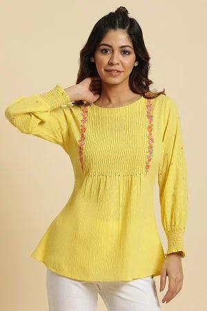 yellow embroidered pintuck top