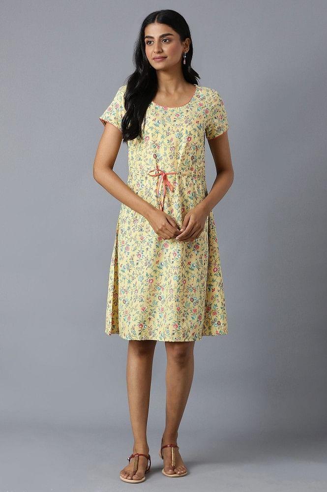 yellow flared dress in floral print and round neck