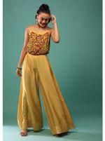 yellow jumpsuit with thread sequins and a floral print