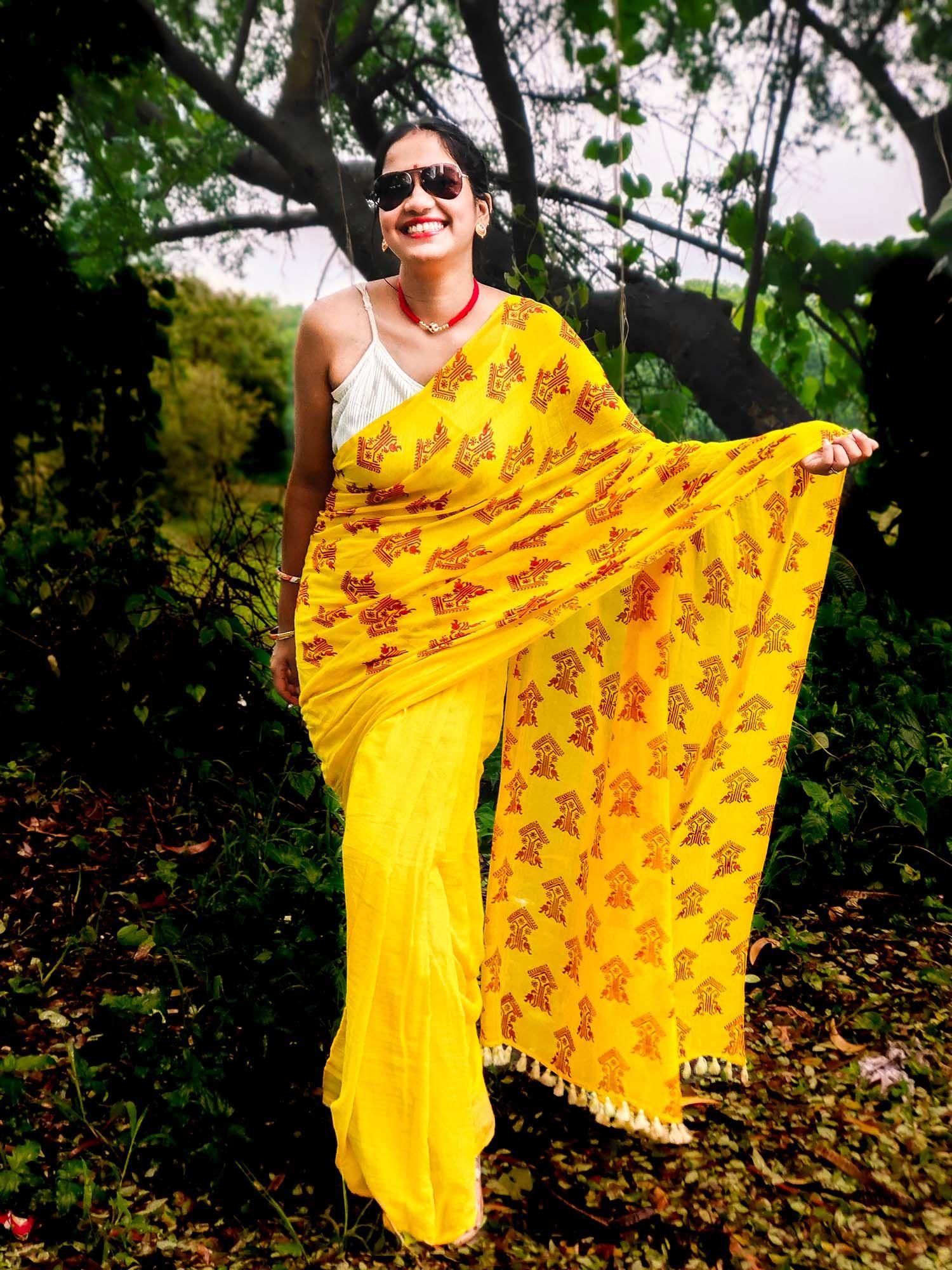 yellow printed assamese gos tree motif mulmul saree without blouse