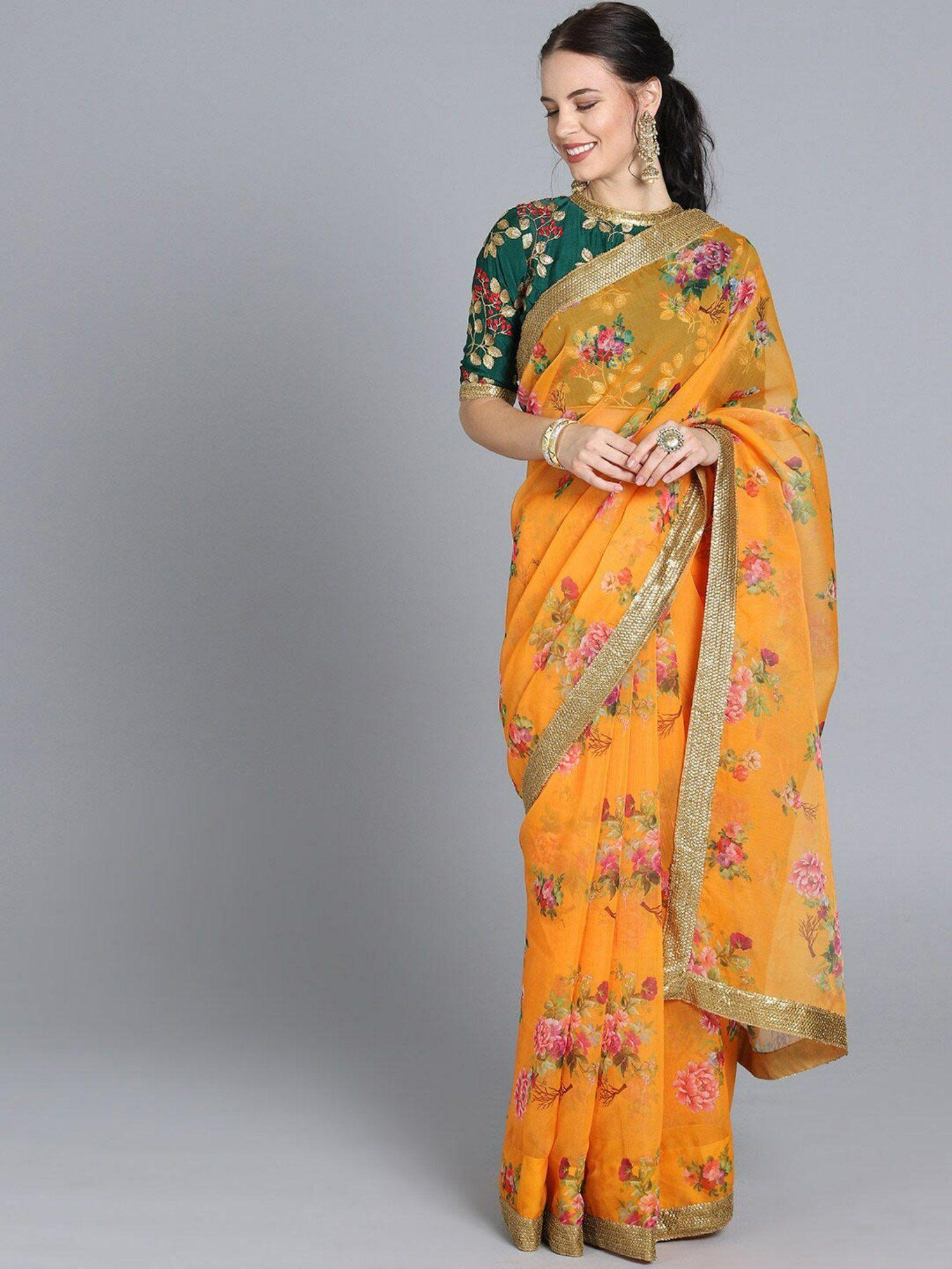 yellow silk saree with green printed unstitched blouse