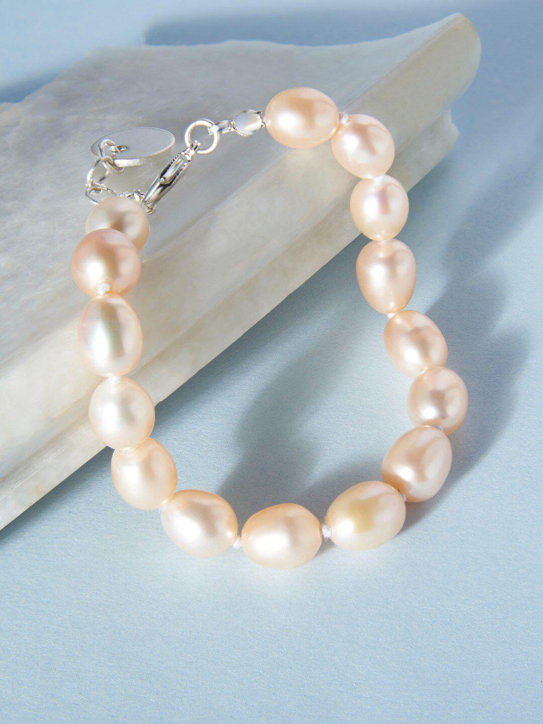 zaveri pearls peach-coloured freshwater natural aaa+ rice single strand bracelet