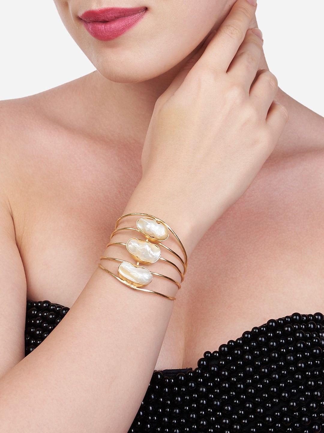 zaveri pearls women gold-plated & white brass pearls cuff bracelet