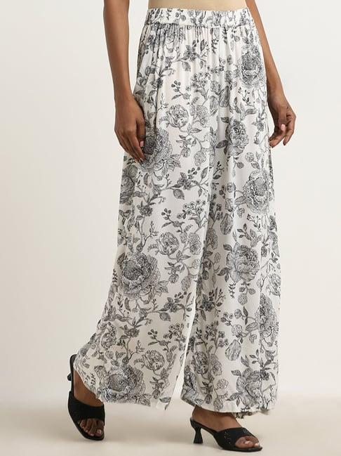 zuba by westside black floral design mid-rise palazzos