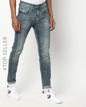 lightly-washed-skinny-jeans-with-distressing