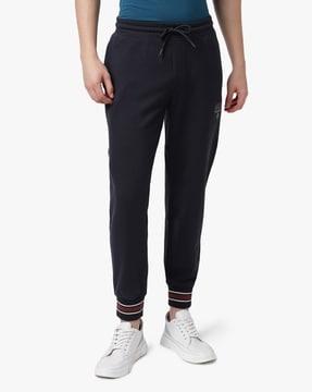 cuffed-track-pants-with-shield-logo