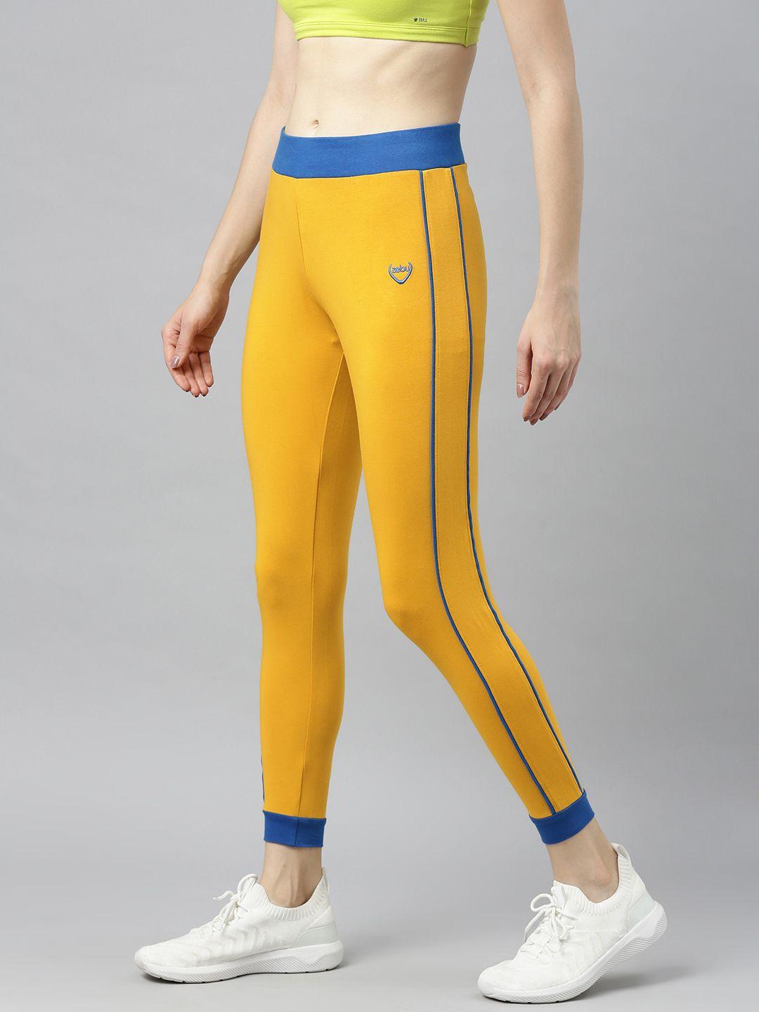 zebu-women-yellow-solid-skinny-fit-cropped-joggers-with-side-stripe-detail