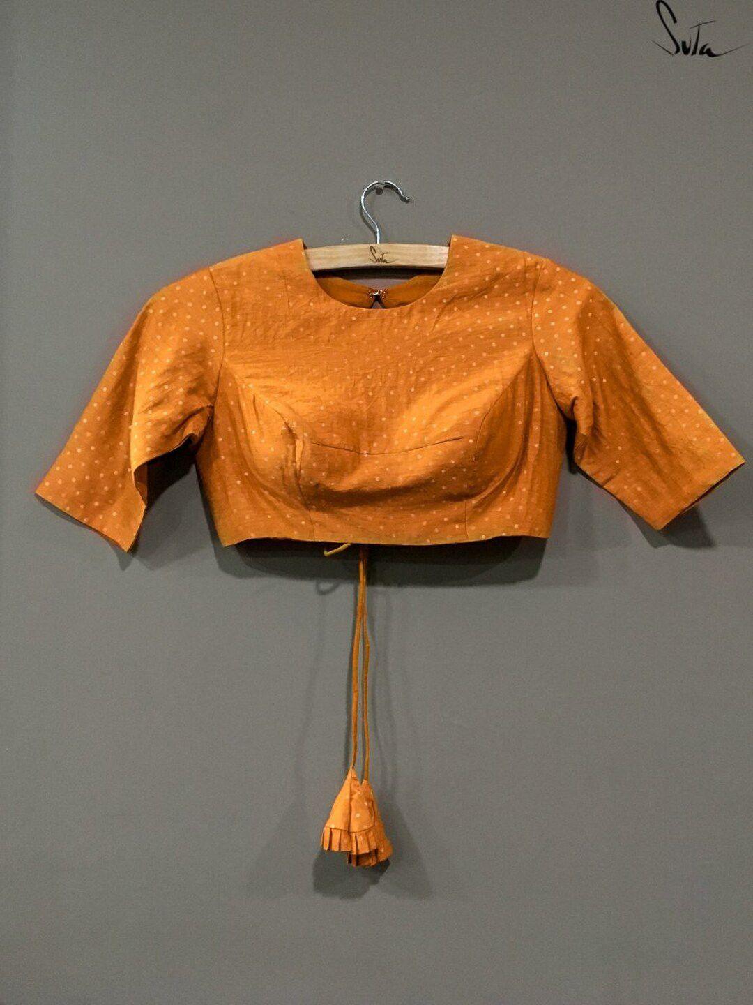 suta-women-golden-color-solid-muga-silk-saree-blouse