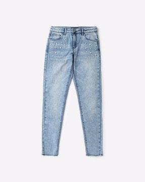 embellished-jeans-with-frayed-hemline