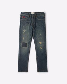 Lightly Washed Distressed Slim Fit Jeans